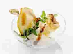 Canape with pear,brie cheese,hazelnut and arugula