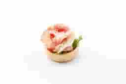 Tartlet with arugula and prosciutto