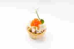 Mini tart with Philadelphia cheese, caviar, smoked fish, and cucumber